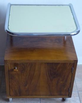 Bedside table made of bent tubes and wooden cabine